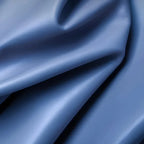 Smooth blue synthetic leather material with a subtle grain texture