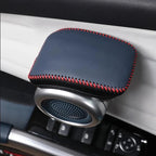 Black leather car cup holder organizer with red stitching and silver metal trim