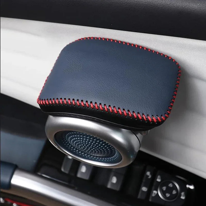 Black leather car cup holder organizer with red stitching and silver metal trim