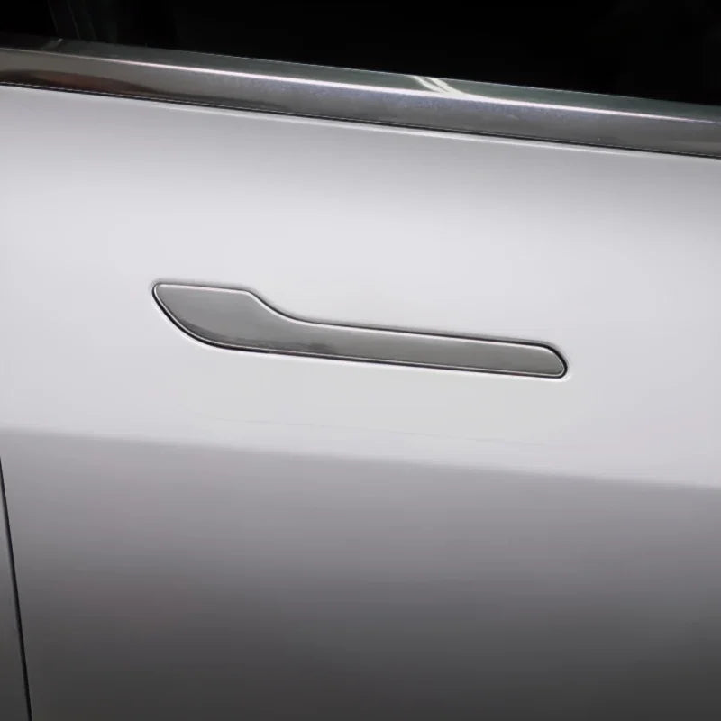 Sleek silver metallic door handle cover for BYD car with a polished chrome finish.