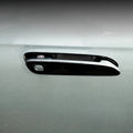 Glossy black car door handle cover with chrome trim and Chinese character emblem.