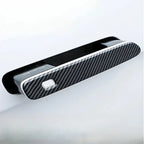 Black carbon fiber pattern car door handle cover for a sleek, protective finish.