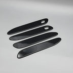 Four black carbon fiber texture door sill protectors for BYD vehicle interior protection.