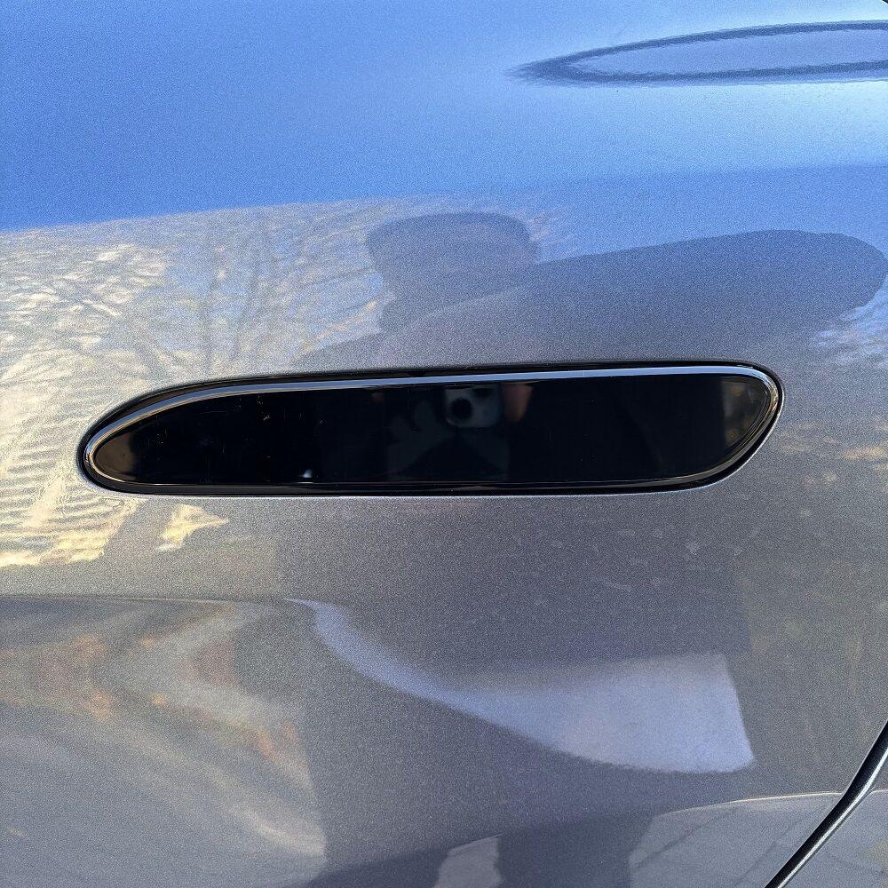 Glossy black door handle cover for car, crafted from durable ABS material.