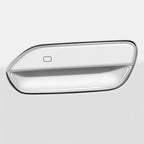 Sleek white automotive door handle cover with a polished chrome trim finish.