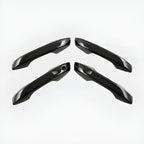 Set of four glossy black aerodynamic car door handles made of high-quality durable material.