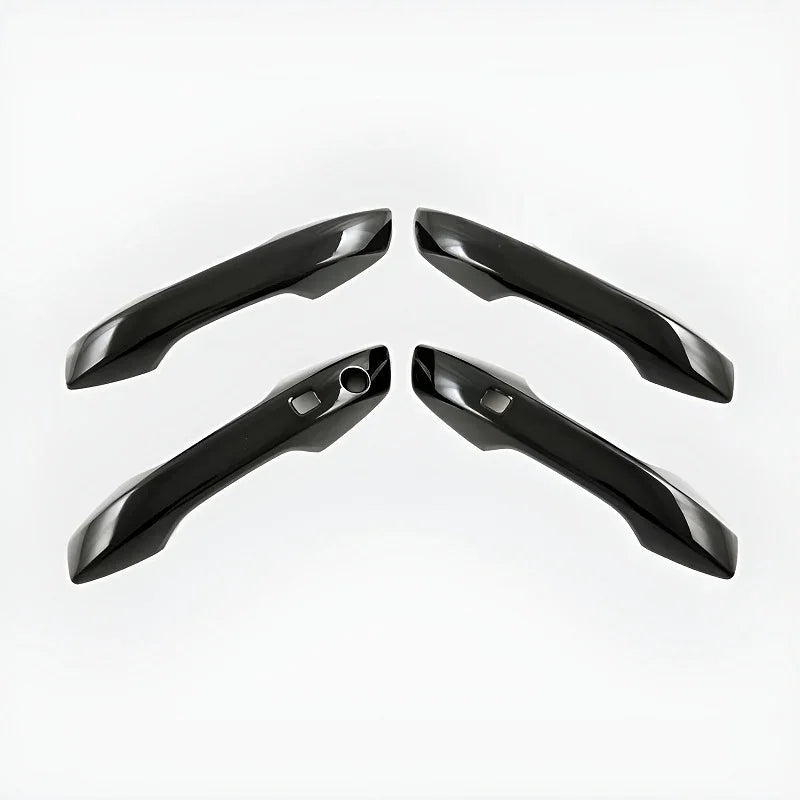 Set of four glossy black aerodynamic car door handles made of high-quality durable material.