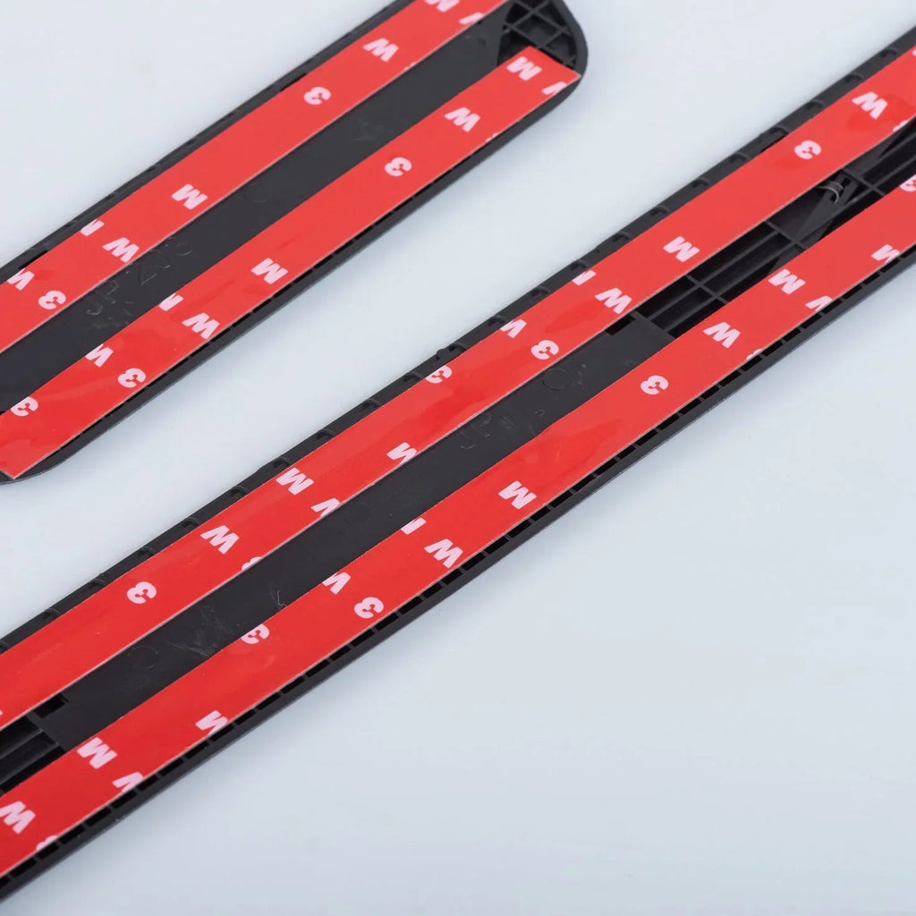 Black durable plastic door sill protector strips with red protective film strips.