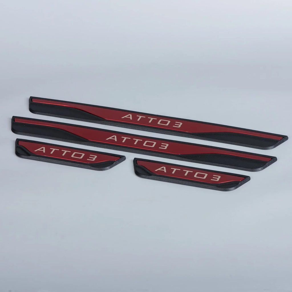 Red and black metallic ATTO 3 door sill protector plates with engraved lettering.