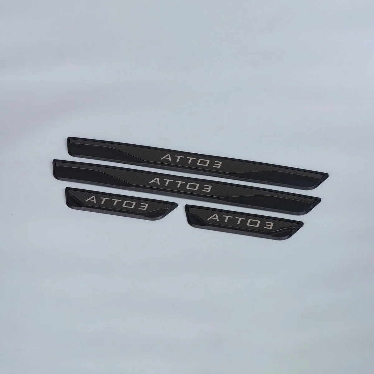 Black carbon fiber texture ATTO 3 door sill protector plates set.