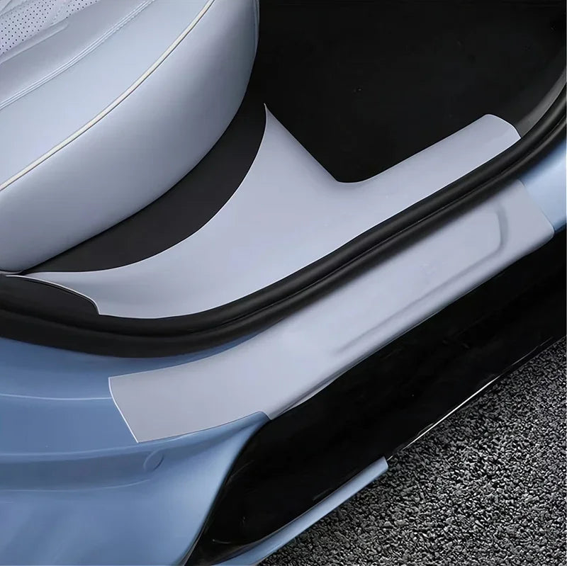 Light blue protective door sill scuff plate made of durable material for BYD car interior.