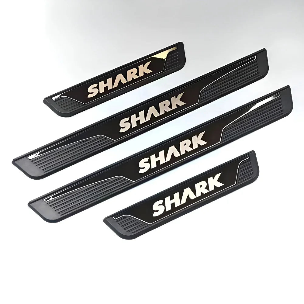 Set of four black matte car door sill protectors featuring bold white SHARK lettering.