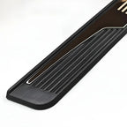 Close-up of a black textured car door sill protector with a sleek silver metallic trim strip.