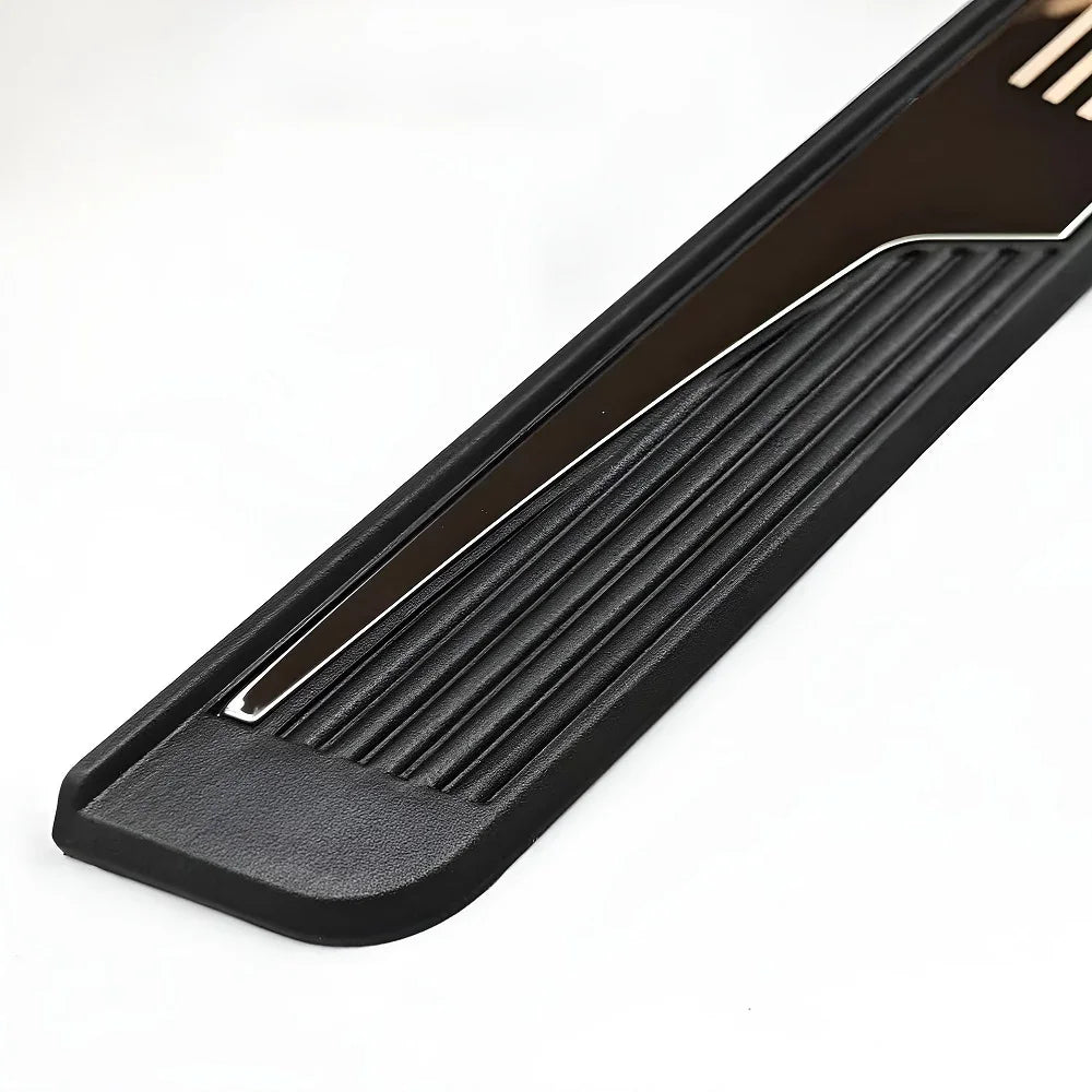 Close-up of a black textured car door sill protector with a sleek silver metallic trim strip.