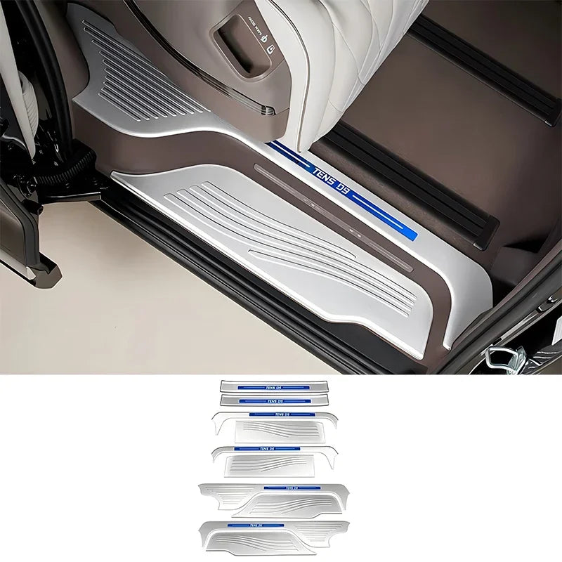 Silver metallic door sill protector plates with blue accent trim for BYD vehicle interior.