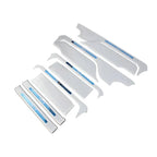 White protective car door sill plates and interior trim accessories set.