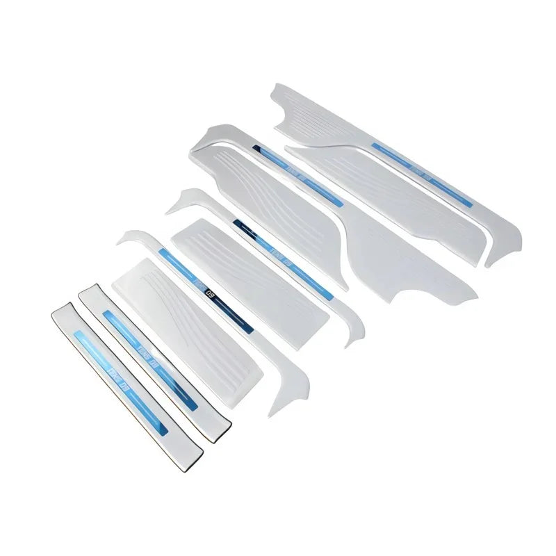 White protective car door sill plates and interior trim accessories set.