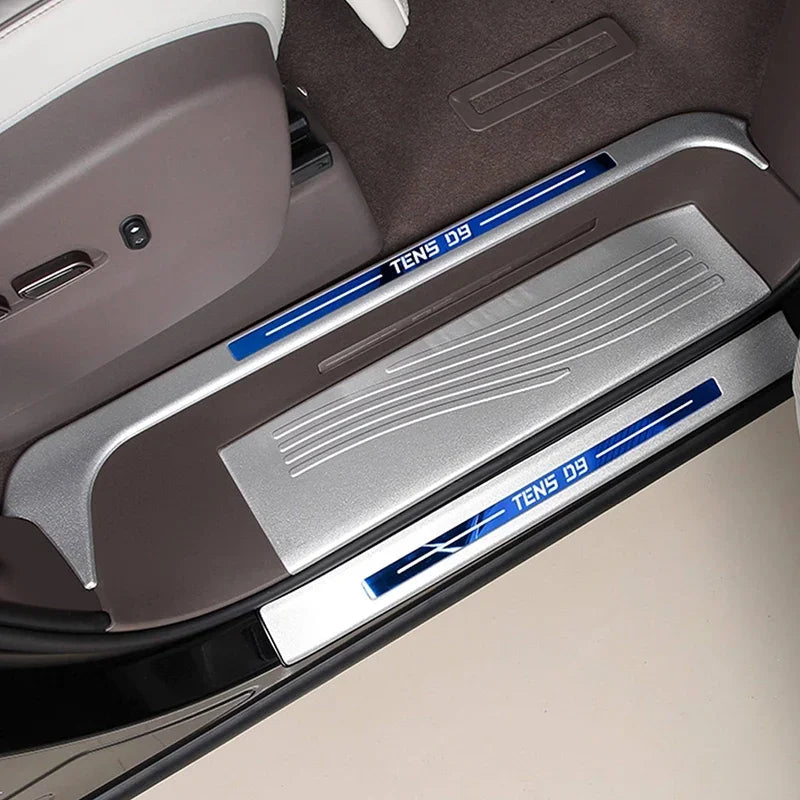 Silver metallic door sill protector with blue TENS D9 accents for car interior protection.