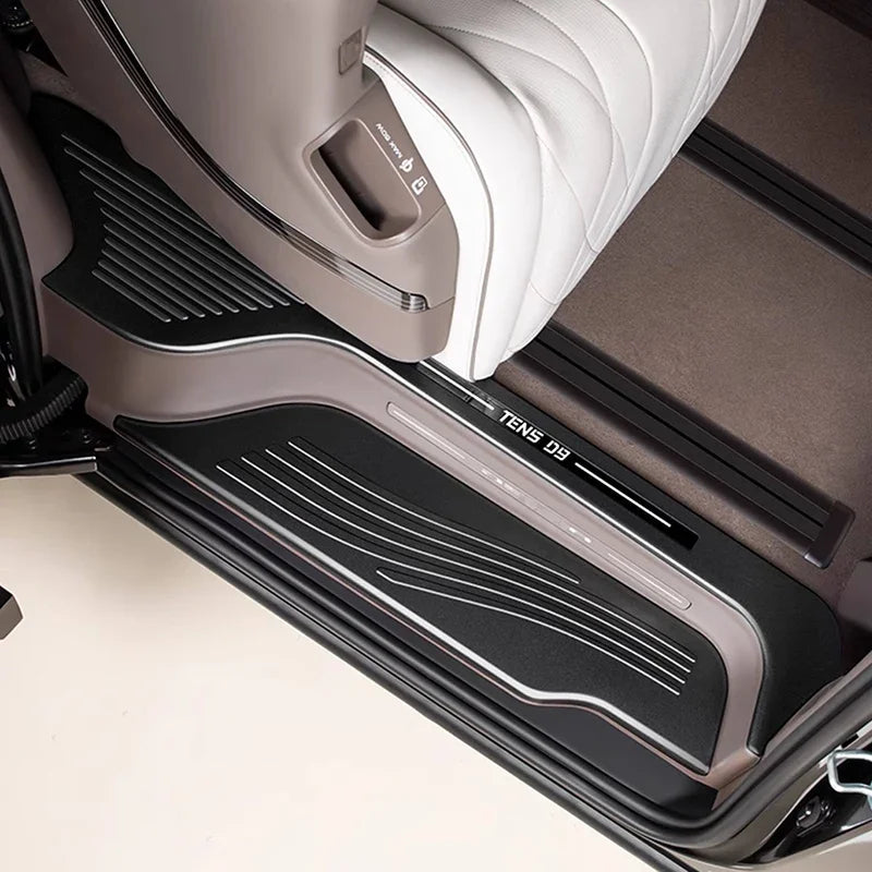Black textured anti-slip door sill protector for BYD Teng i D9 with sleek metallic trim.