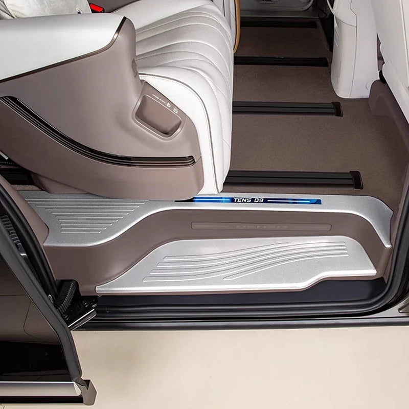 Silver metallic door sill protector with textured anti-slip surface for BYD interior protection.