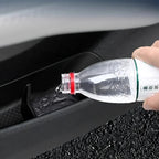 Water being poured into a black waterproof car door pocket protector.