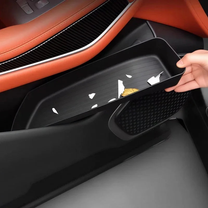 Black textured organizer tray for BYD center console, made of durable matte material.