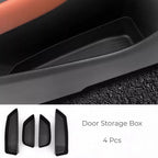 Set of 4 black matte TPE door storage box trays for customized car interior organization.