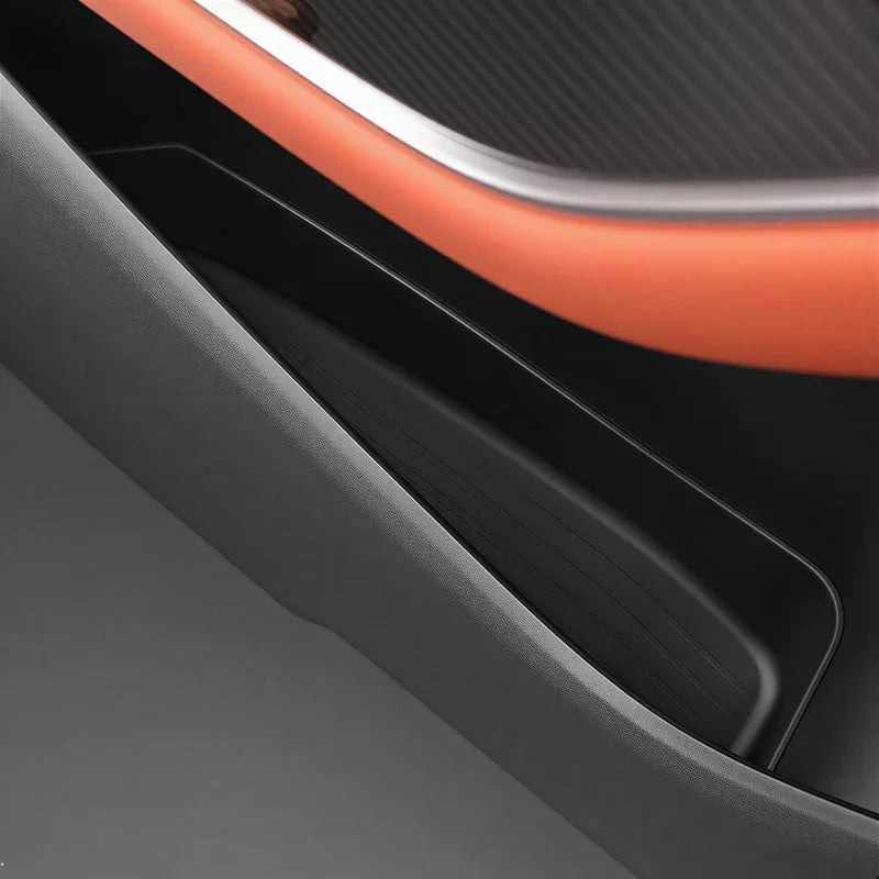 Black textured protective door sill trim with premium matte finish for car interior protection.