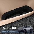 Black textured plastic Denza B8 door storage box tray for organized car interior storage.