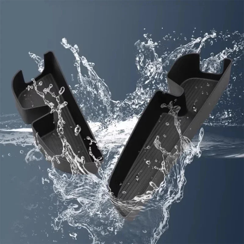 Waterproof black TPE car trunk mat splashing with water for durable protection.