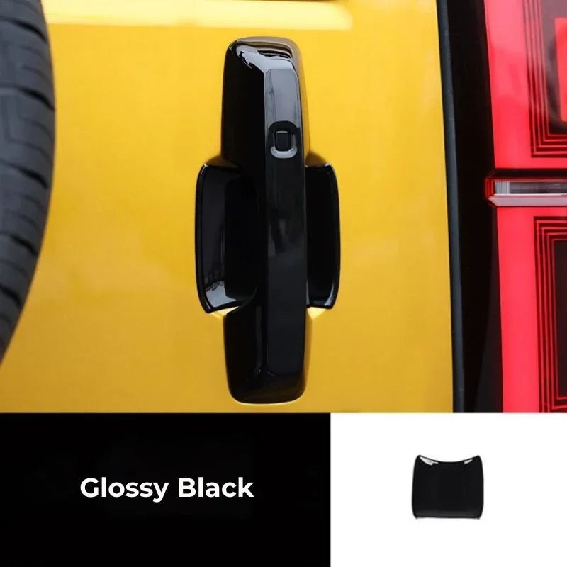 Glossy black durable material door handle cover for a yellow car.