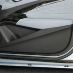 Premium light grey leather-textured door panel trim with sleek black protective cover.