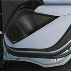 Light blue and black premium leather car door panel with integrated mesh speaker grille.