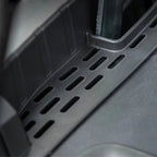 Black textured anti-slip floor mat with precision ventilation slots for BYD vehicle protection.