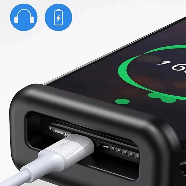 Close-up of a white charging cable plugged into a matte black protective car accessory case.