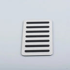 Silver brushed aluminum car pedal cover with black anti-slip rubber grips.