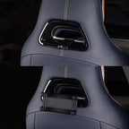 Premium navy blue leather car seat with integrated black gloss storage organizer and contrast stitching.