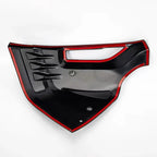 Glossy black car door trim accessory with striking red accent trim.