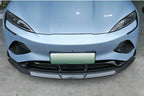 Light blue car front bumper featuring a sleek black carbon fiber front lip spoiler.