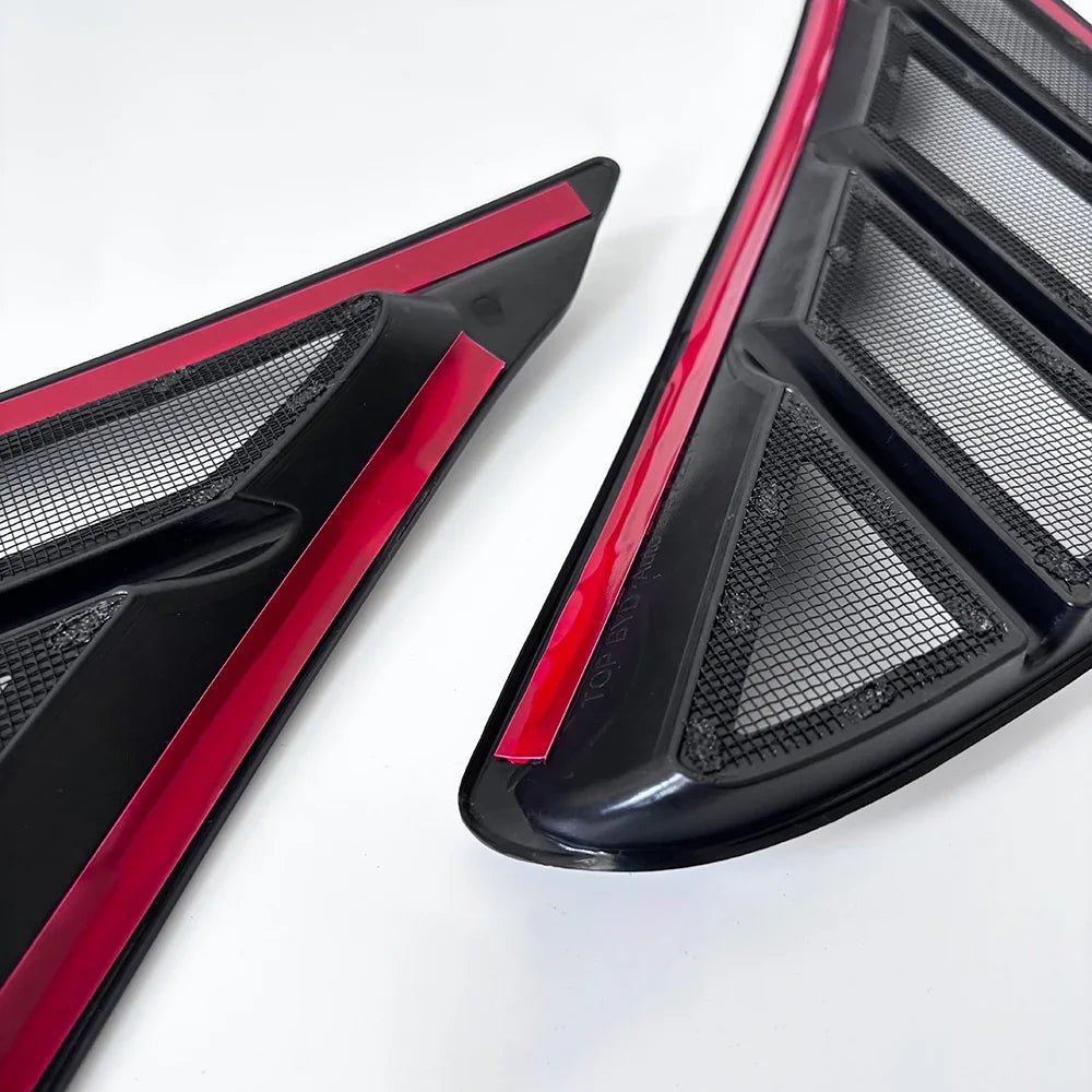 Black mesh grille inserts with red trim accents for BYD vehicle aftermarket accessories.