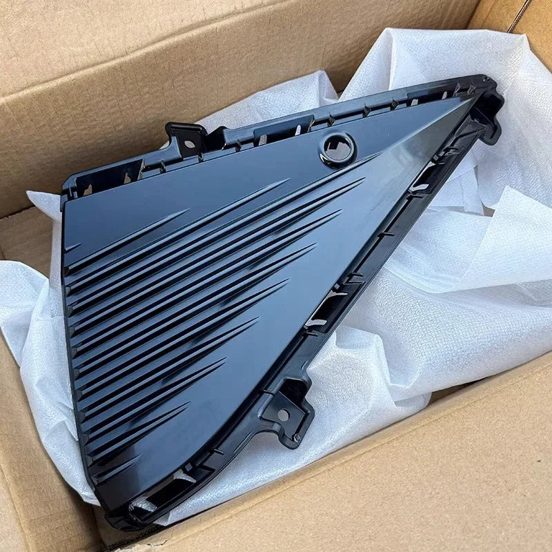 Black gloss plastic automotive trim component for BYD vehicle in a shipping box