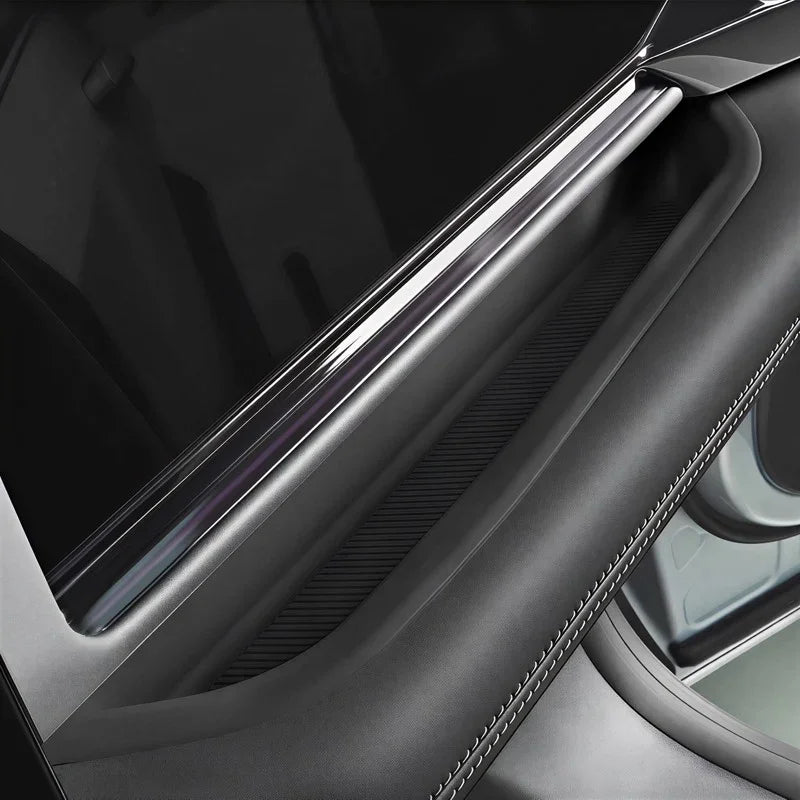 Sleek black door sill protector with a polished metallic finish for premium car interior protection.