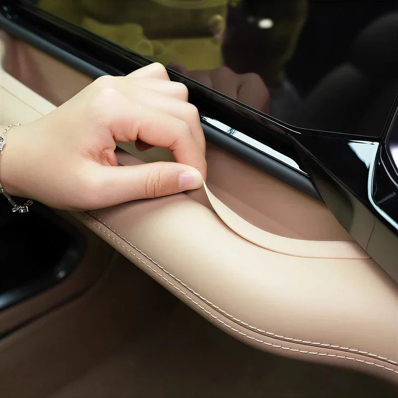 Premium beige leather door armrest cover with precision stitching for BYD car interior protection.