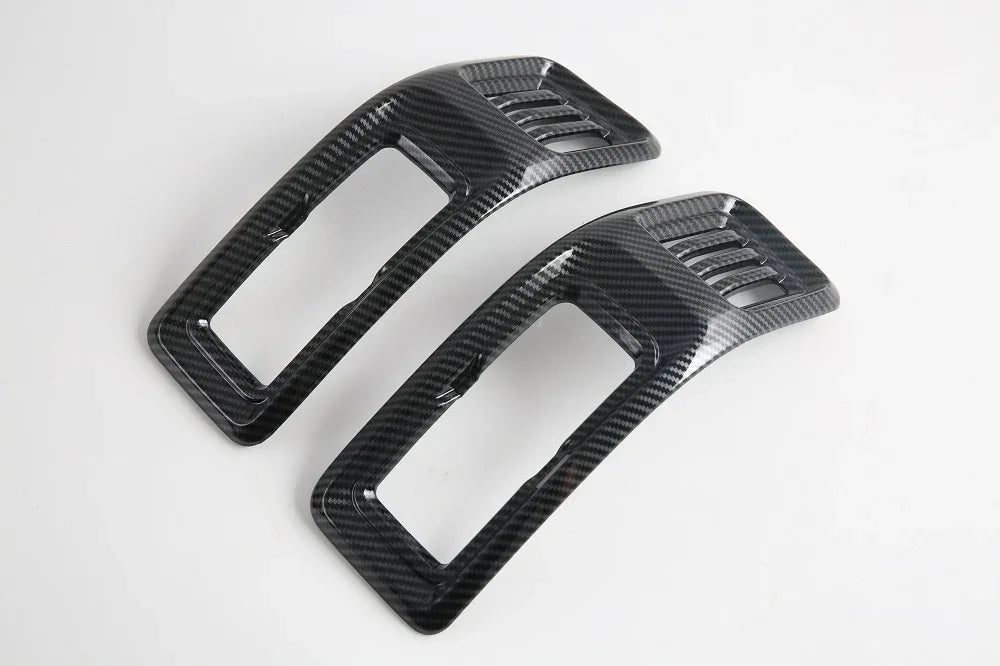 Pair of black carbon fiber texture interior trim covers for automotive enhancement.