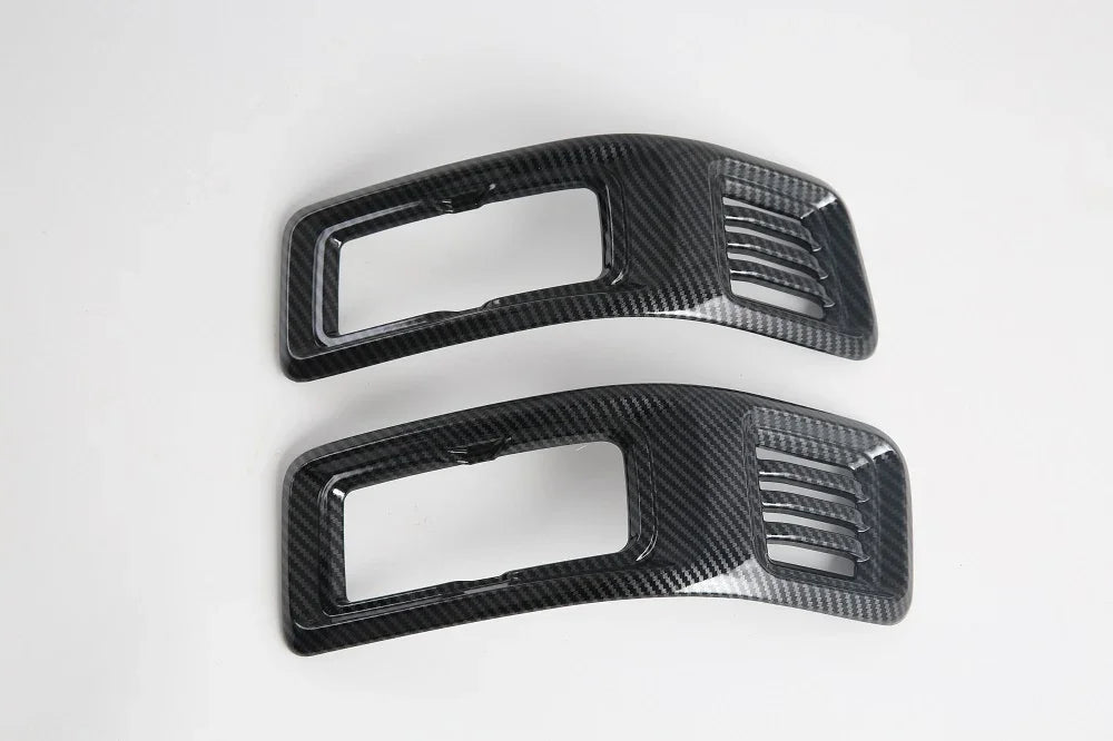 Pair of black carbon fiber pattern interior trim accessories for BYD vehicle enhancement.