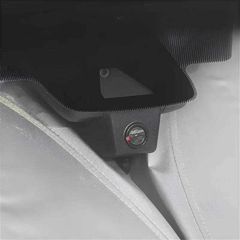 Black textured protective cover with a built-in red indicator light for car interior accessories.