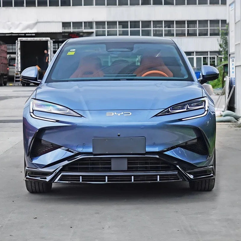 Front view of a blue BYD electric car with a sleek design and sporty black lower trim.