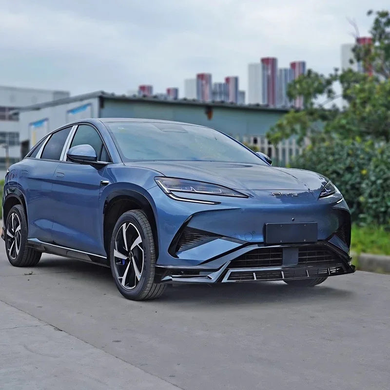Front view of a sleek, metallic blue electric car with aerodynamic body kit and alloy wheels.