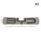 Silver metallic BYD emblem with precise dimensions for automotive aftermarket accessory.