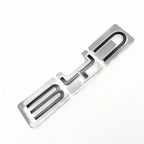 Chrome silver BYD emblem badge with black inlay for premium car exterior styling.